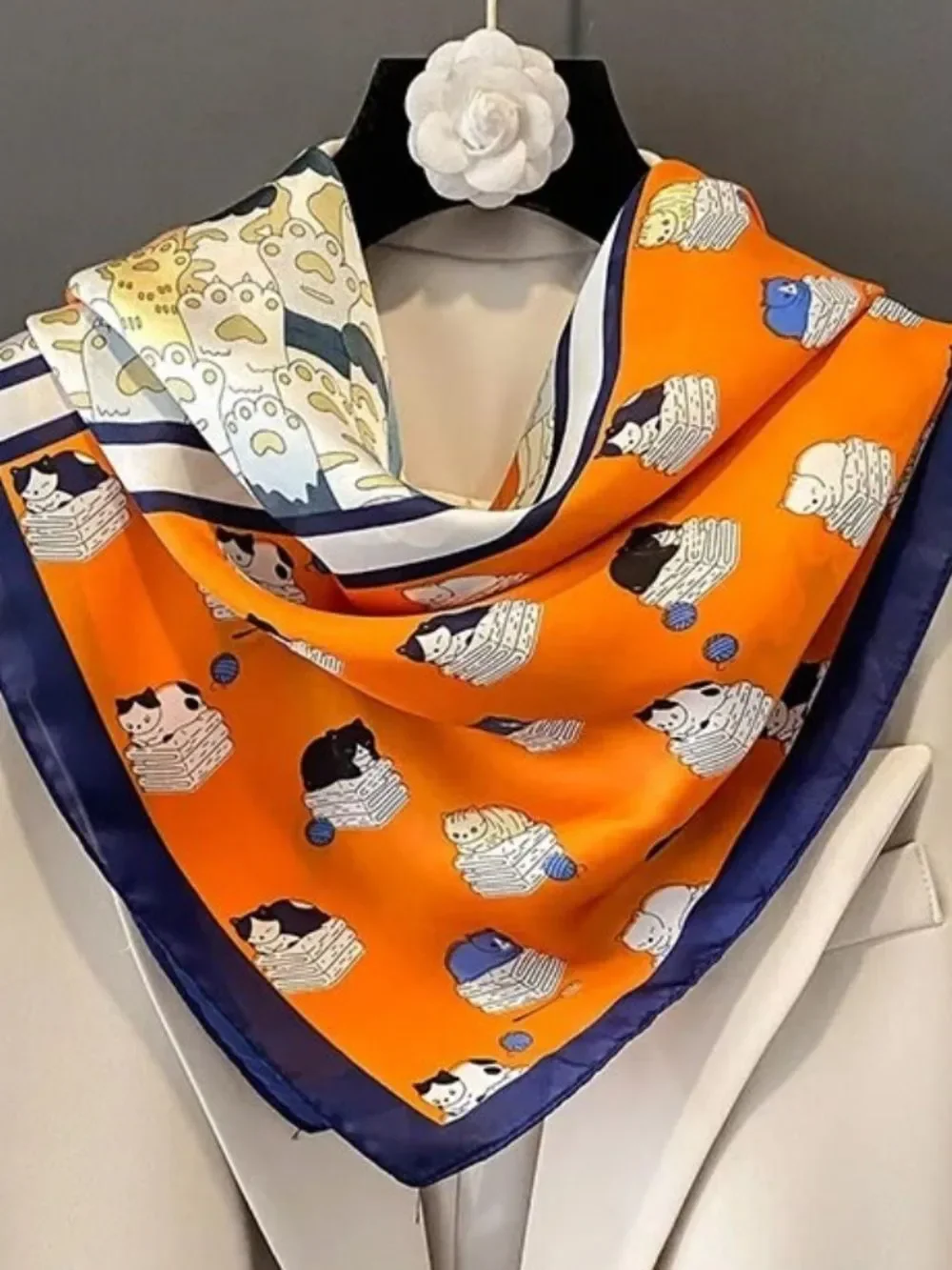 Playful Cat Paw Scarf in Orange & Navy feels like silk is polyester